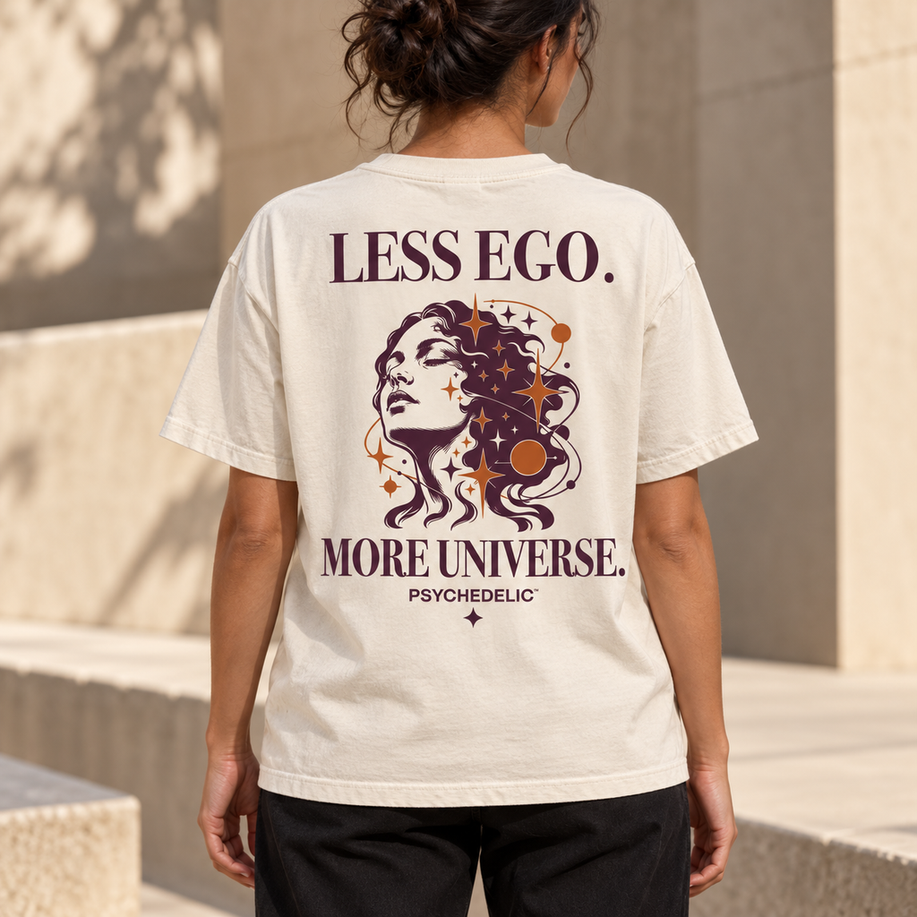 Less Ego. More Universe. Tee in Ivory — AI lifestyle mockup, rear view