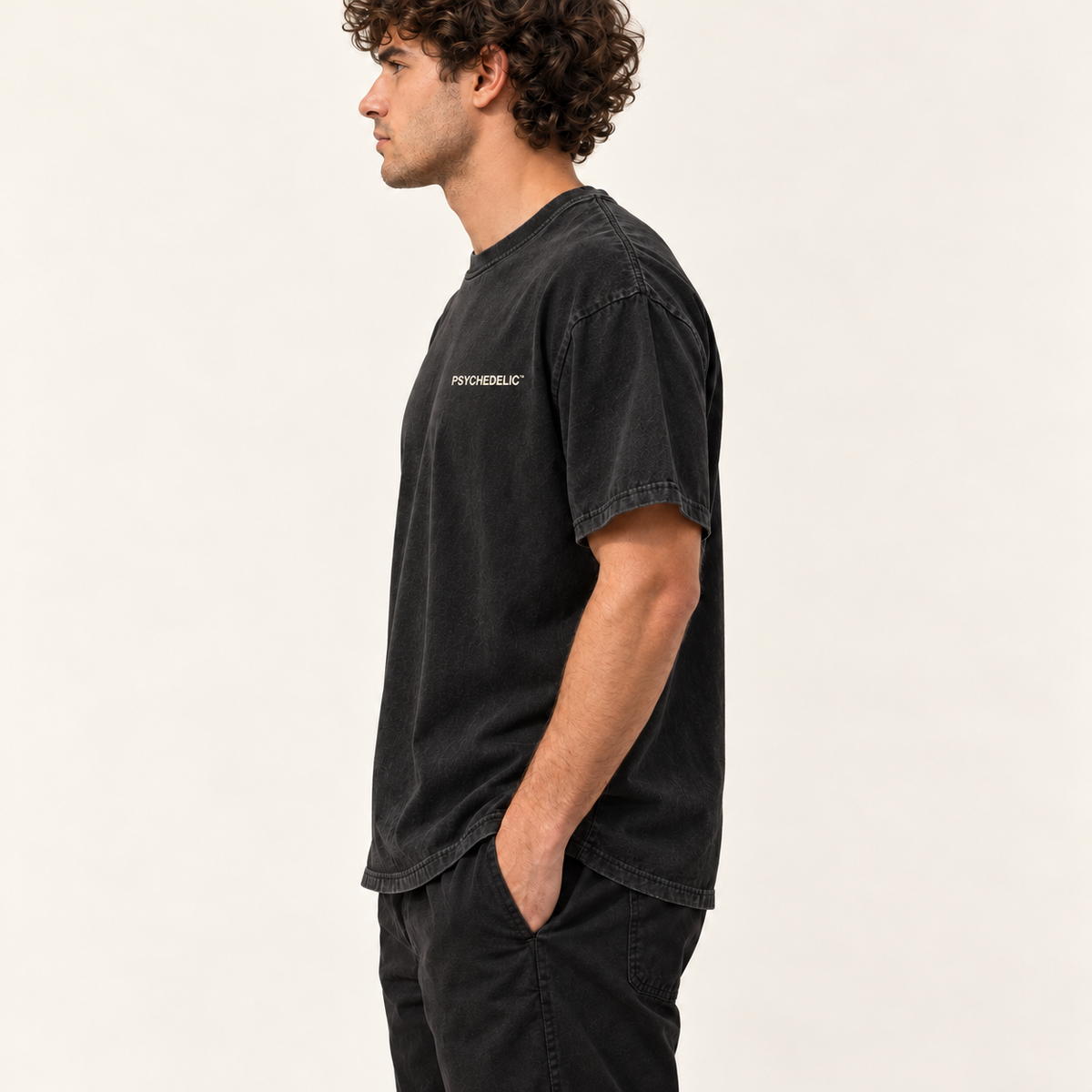 Reality Is a Working Theory Tee in Black — AI studio mockup, side profile